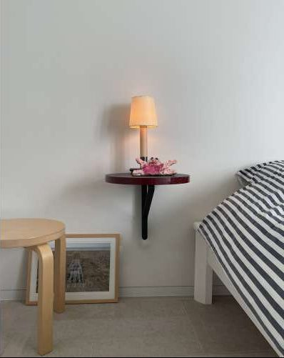 Kaari Wall Shelf Round by Artek, in situ